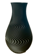 A modern spiral decorative vase designed specifically for high-quality 3D printing. Its flowing wave geometry creates a stunning visual effect and gives the model a premium artistic appearance.